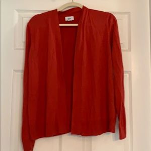 Reddish orange sweater